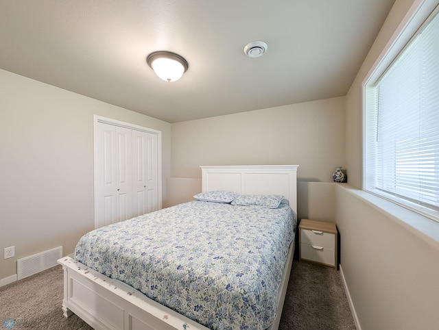 2715 11th St W, West Fargo, ND 58078 - bedroom featuring dark colored carpet and a closet