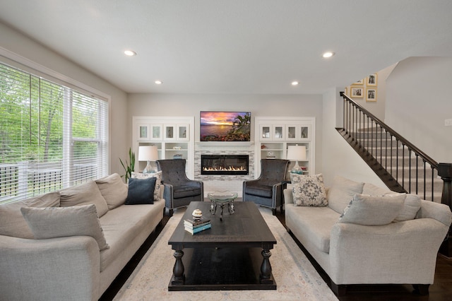 12601 Ridgemount Ave W, Minnetonka, MN 55305 - living room featuring a glass covered fireplace, recessed lighting, and stairs