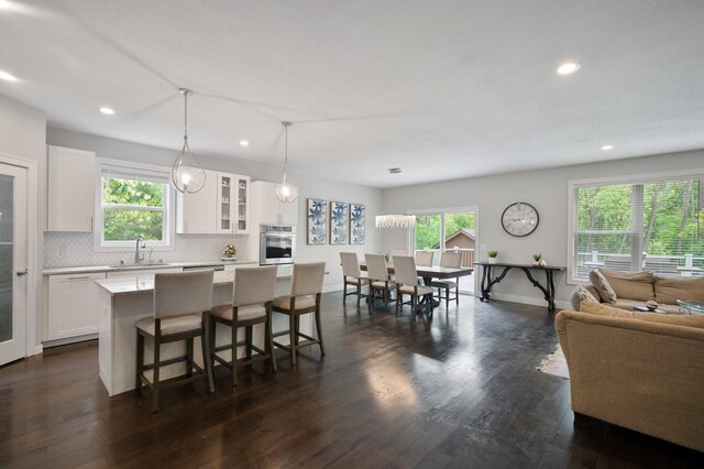 12601 Ridgemount Ave W, Minnetonka, MN 55305 - kitchen featuring a sink, stainless steel oven, plenty of natural light, recessed lighting, and decorative backsplash