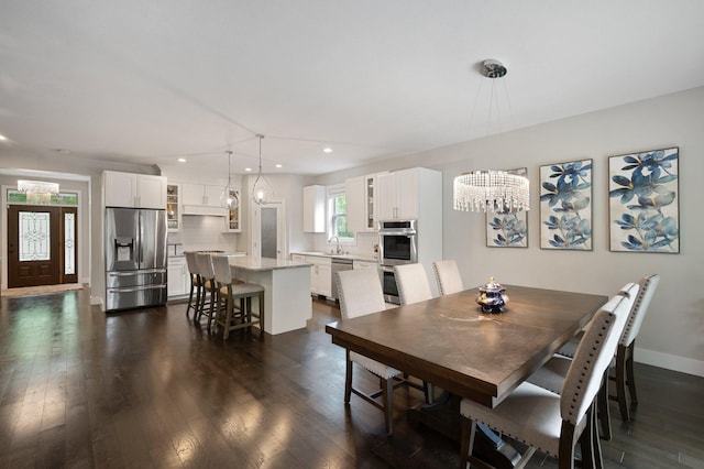 12601 Ridgemount Ave W, Minnetonka, MN 55305 - dining room featuring a chandelier, recessed lighting, dark wood-style floors, and baseboards