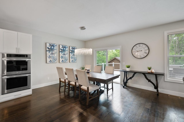 12601 Ridgemount Ave W, Minnetonka, MN 55305 - dining area featuring baseboards, healthy amount of natural light, dark wood-style flooring, and a chandelier