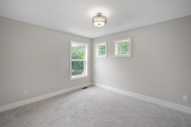 12601 Ridgemount Ave W, Minnetonka, MN 55305 - empty room with plenty of natural light, baseboards, and carpet floors