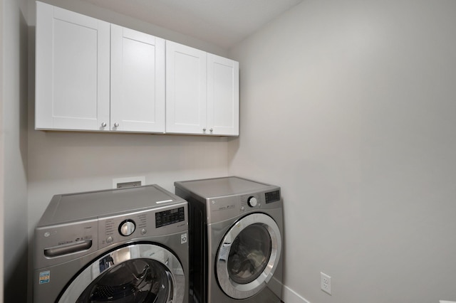 12601 Ridgemount Ave W, Minnetonka, MN 55305 - laundry room with cabinet space, washing machine and dryer, and baseboards