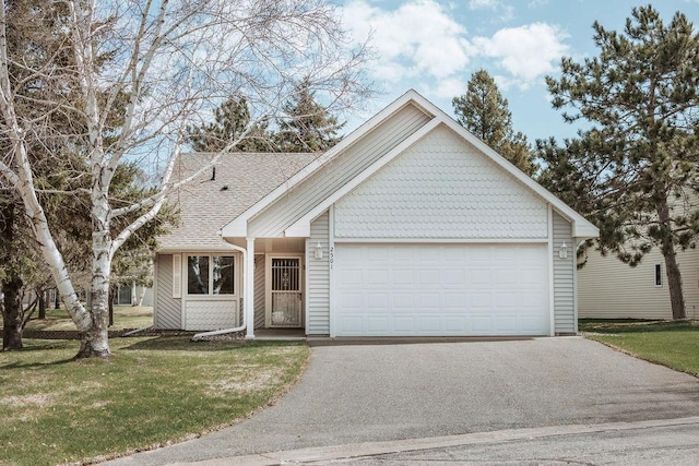 2501 Woodridge Ln, Brainerd, MN 56401 - view of front facade with driveway, an attached garage, a front yard, and roof with shingles