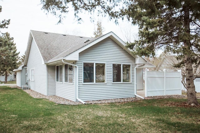 2501 Woodridge Ln, Brainerd, MN 56401 - rear view of house featuring a shingled roof and cooling unit
