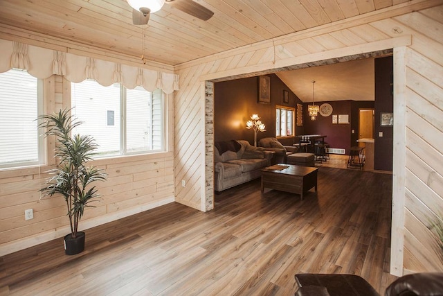2501 Woodridge Ln, Brainerd, MN 56401 - living room featuring wood walls, wood ceiling, a chandelier, wood finished floors, and lofted ceiling