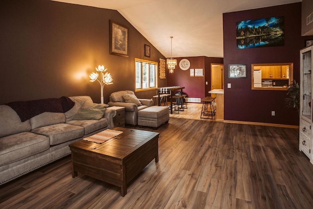 2501 Woodridge Ln, Brainerd, MN 56401 - living room with a chandelier, wood finished floors, lofted ceiling, and baseboards