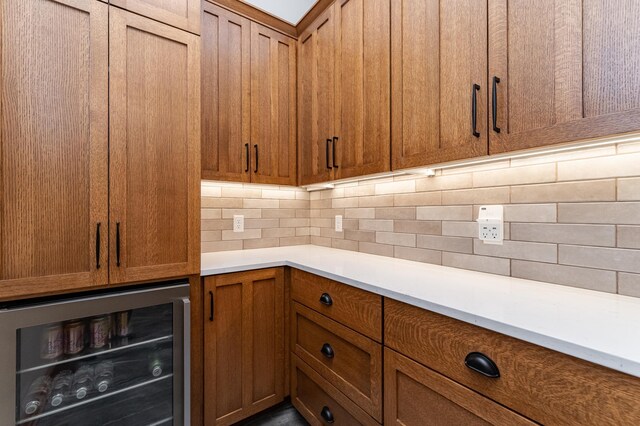 918 Hidden Meadow Ln, Lake City, MN 55041 - kitchen with wine cooler, tasteful backsplash, brown cabinets, and light countertops