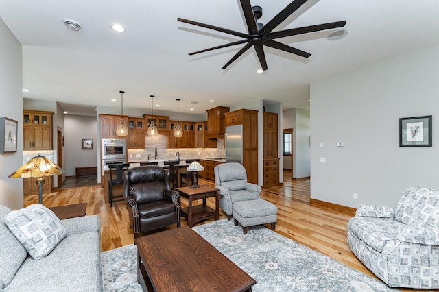 918 Hidden Meadow Ln, Lake City, MN 55041 - living area with a ceiling fan, light wood-type flooring, baseboards, and recessed lighting
