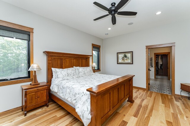 918 Hidden Meadow Ln, Lake City, MN 55041 - bedroom with light wood finished floors, baseboards, recessed lighting, and ceiling fan