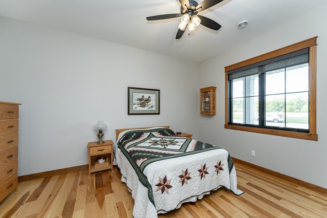 918 Hidden Meadow Ln, Lake City, MN 55041 - bedroom with light wood finished floors, baseboards, and a ceiling fan