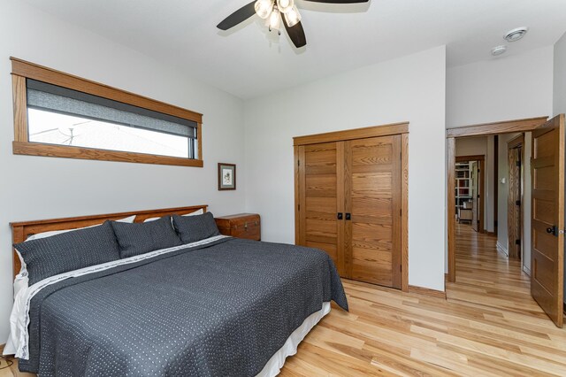 918 Hidden Meadow Ln, Lake City, MN 55041 - bedroom with light wood-type flooring, a closet, and ceiling fan