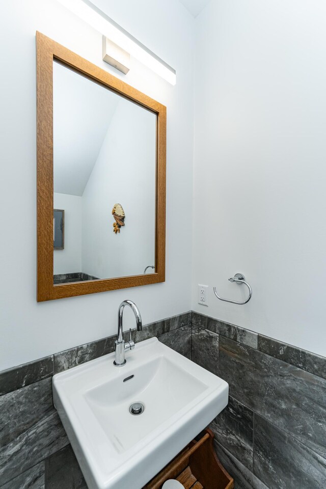 918 Hidden Meadow Ln, Lake City, MN 55041 - bathroom featuring a sink, tile walls, and a wainscoted wall