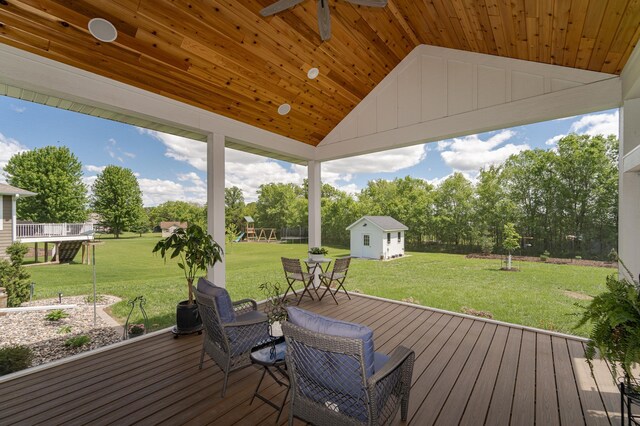 918 Hidden Meadow Ln, Lake City, MN 55041 - wooden terrace featuring an outbuilding, a yard, ceiling fan, and view of scattered trees