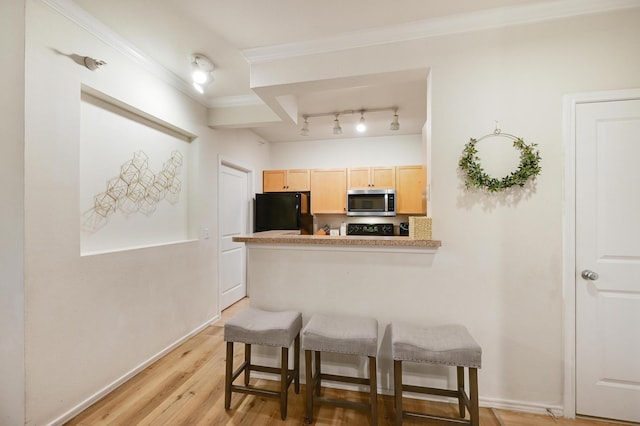 13580 Technology Dr Unit 3222, Eden Prairie, MN 55344 - kitchen featuring freestanding refrigerator, stainless steel microwave, light brown cabinets, a kitchen breakfast bar, and crown molding