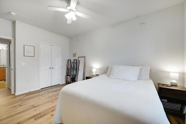 13580 Technology Dr Unit 3222, Eden Prairie, MN 55344 - bedroom with light wood-style flooring, a closet, baseboards, and a ceiling fan