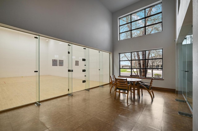 13580 Technology Dr Unit 3222, Eden Prairie, MN 55344 - dining room featuring a high ceiling and tile patterned floors