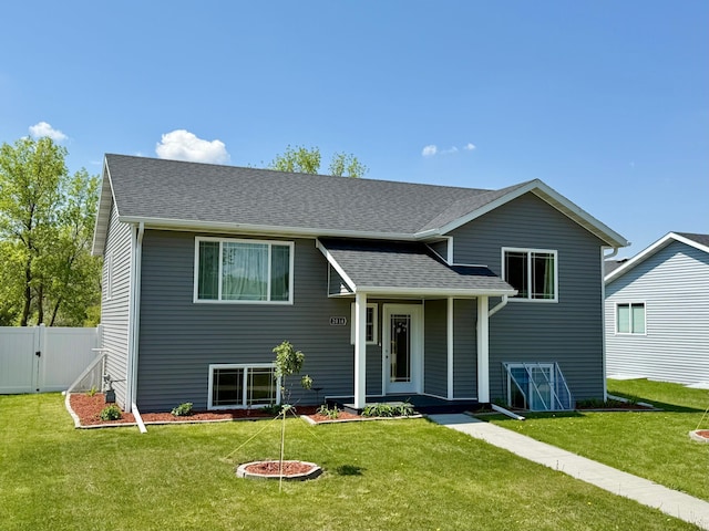 2014 Nelson Dr, Thief River Falls, MN 56701 - split level home with a gate and a shingled roof