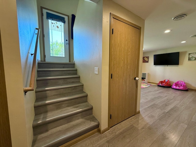 2014 Nelson Dr, Thief River Falls, MN 56701 - stairs featuring wood finished floors, recessed lighting, and baseboards