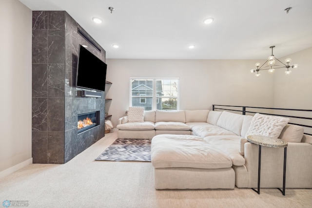 5837 41st St S, Fargo, ND 58104 - carpeted living room featuring a chandelier, a premium fireplace, recessed lighting, and baseboards