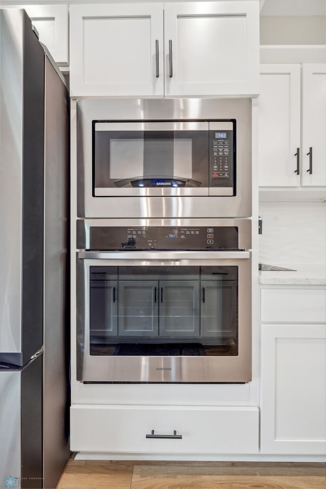 5837 41st St S, Fargo, ND 58104 - kitchen view of stainless steel appliances and white cabinetry