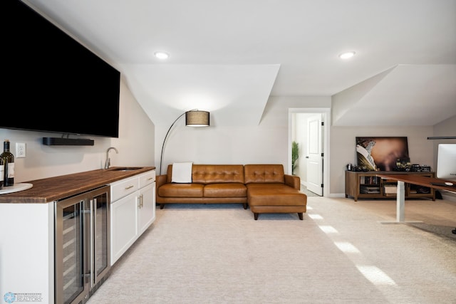 5837 41st St S, Fargo, ND 58104 - living room with beverage cooler, wet bar, light colored carpet, and recessed lighting