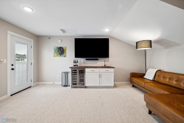 5837 41st St S, Fargo, ND 58104 - living room featuring wet bar, light colored carpet, baseboards, lofted ceiling, and recessed lighting