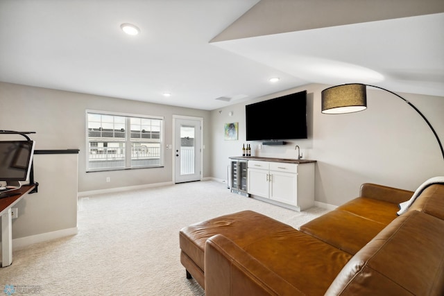 5837 41st St S, Fargo, ND 58104 - living area with wine cooler, bar with sink, baseboards, light carpet, and recessed lighting