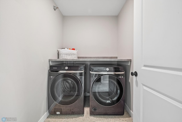 5837 41st St S, Fargo, ND 58104 - laundry area featuring washer and dryer and baseboards