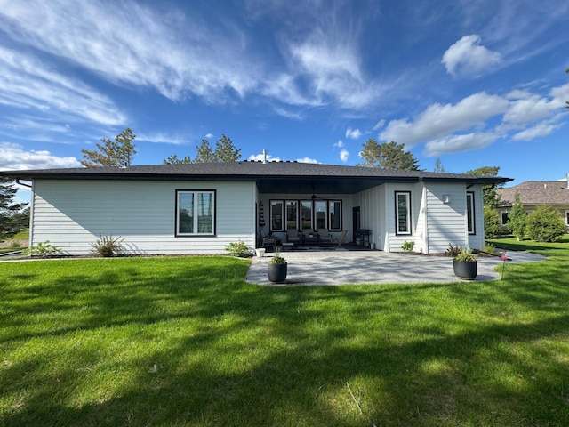 807 Whitetail Ln, Detroit Lakes, MN 56501 - back of property with a patio area and a lawn