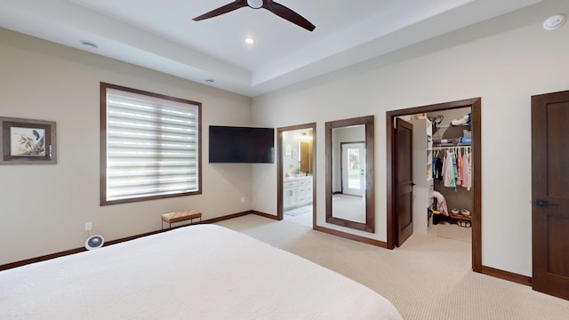 807 Whitetail Ln, Detroit Lakes, MN 56501 - bedroom with a walk in closet, multiple windows, light colored carpet, baseboards, and recessed lighting