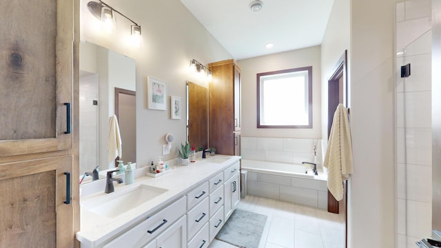 807 Whitetail Ln, Detroit Lakes, MN 56501 - full bathroom with double vanity, a garden tub, and tile patterned flooring