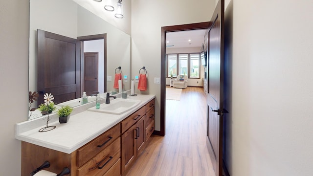 807 Whitetail Ln, Detroit Lakes, MN 56501 - bathroom with wood finished floors and vanity