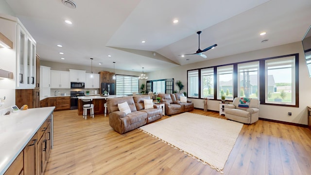 807 Whitetail Ln, Detroit Lakes, MN 56501 - living area with plenty of natural light, light wood finished floors, recessed lighting, lofted ceiling, and a ceiling fan