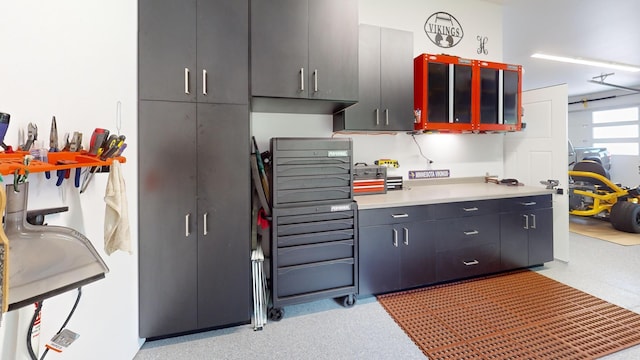 807 Whitetail Ln, Detroit Lakes, MN 56501 - kitchen featuring light countertops and glass insert cabinets