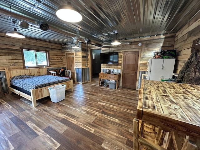 46824 Foss Rd, Osage, MN 56570 - bedroom featuring freestanding refrigerator, dark wood-style floors, wood walls, wood ceiling, and log walls