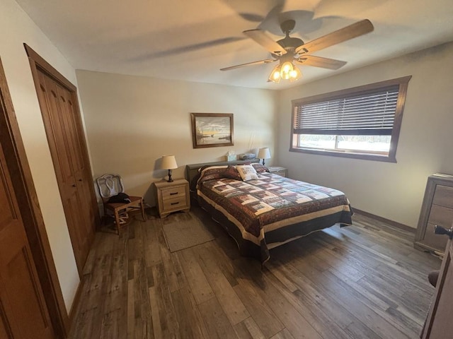 46824 Foss Rd, Osage, MN 56570 - bedroom featuring dark wood-type flooring, a ceiling fan, and baseboards
