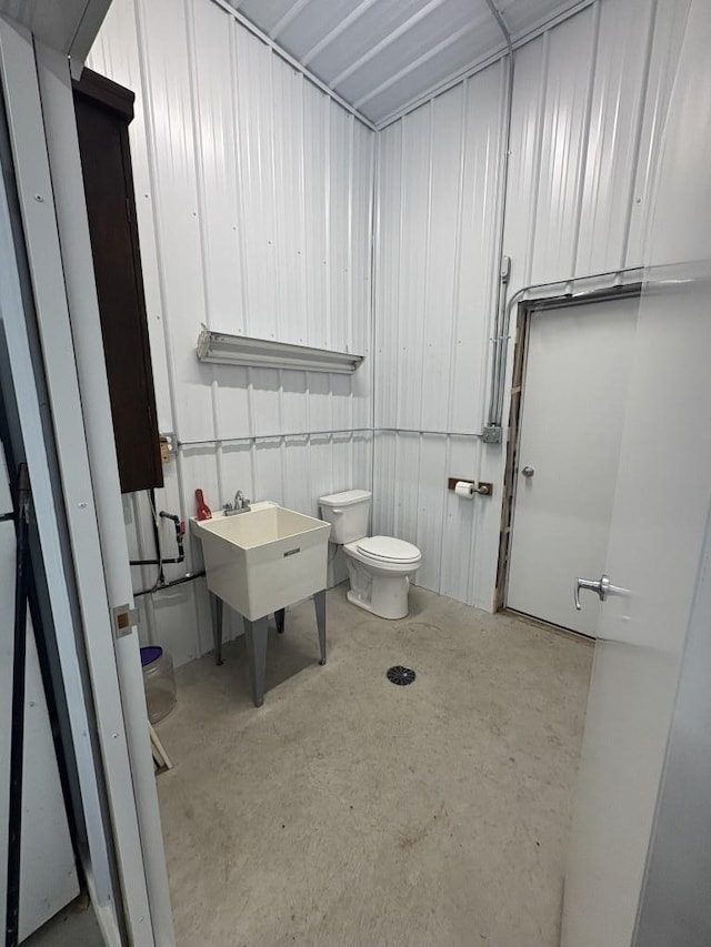 46824 Foss Rd, Osage, MN 56570 - bathroom featuring toilet and concrete floors