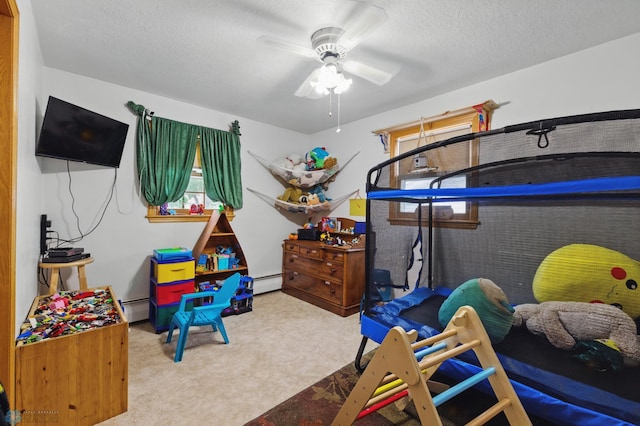 1013 15 1/2 St N, Moorhead, MN 56560 - bedroom featuring carpet flooring, a baseboard radiator, and a textured ceiling