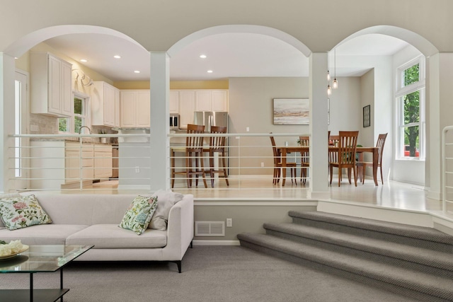6609 Red Birch Ct, Lino Lakes, MN 55014 - carpeted living area with arched walkways and recessed lighting