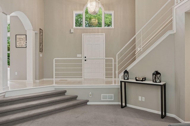 6609 Red Birch Ct, Lino Lakes, MN 55014 - entrance foyer with stairs, carpet, arched walkways, and baseboards