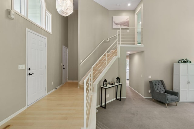 6609 Red Birch Ct, Lino Lakes, MN 55014 - entryway with stairway, a high ceiling, plenty of natural light, and baseboards