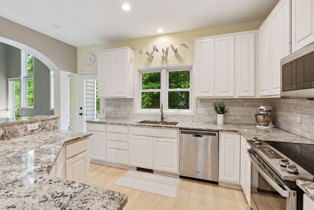 6609 Red Birch Ct, Lino Lakes, MN 55014 - kitchen with a sink, stainless steel appliances, light wood-type flooring, healthy amount of natural light, and recessed lighting