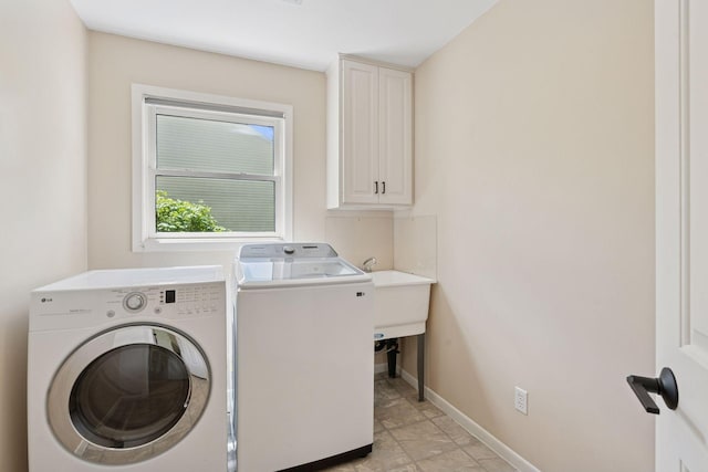 6609 Red Birch Ct, Lino Lakes, MN 55014 - laundry area with separate washer and dryer, cabinet space, and baseboards