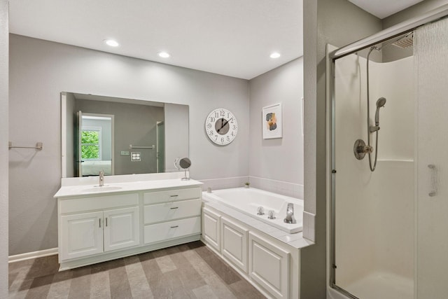 6609 Red Birch Ct, Lino Lakes, MN 55014 - full bathroom featuring a stall shower, a garden tub, vanity, and recessed lighting