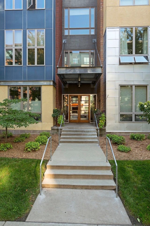 2840 Bryant Ave S Unit E303, Minneapolis, MN 55408 - entrance to property with french doors, stucco siding, and a balcony