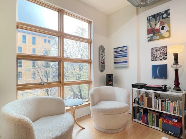 2840 Bryant Ave S Unit E303, Minneapolis, MN 55408 - sitting room featuring wood finished floors and baseboards