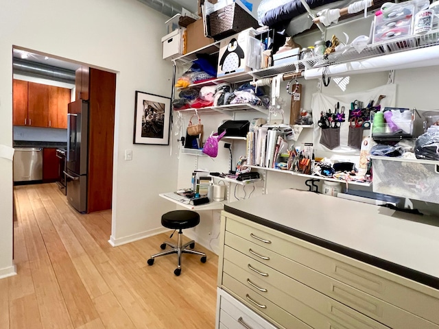 2840 Bryant Ave S Unit E303, Minneapolis, MN 55408 - walk in closet featuring light wood finished floors