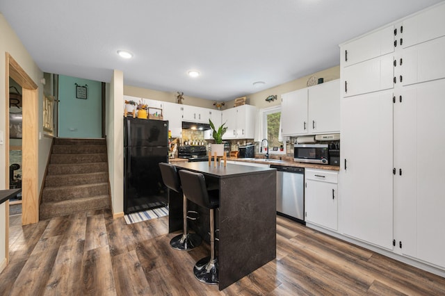 3108 4th Ave, Grand Rapids, MN 55744 - kitchen with black appliances, a sink, white cabinetry, dark wood-style floors, and recessed lighting