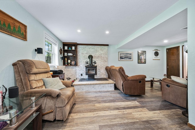 3108 4th Ave, Grand Rapids, MN 55744 - living area featuring wood finished floors, recessed lighting, and a wood stove